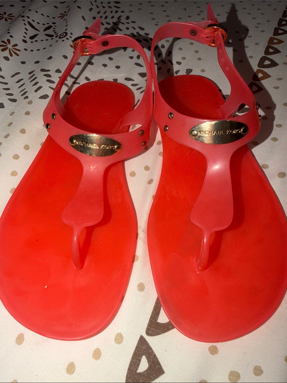 Michael Kors Women's Red Jelly T-Strap Sandals with Gold Plaque

Sangria Color